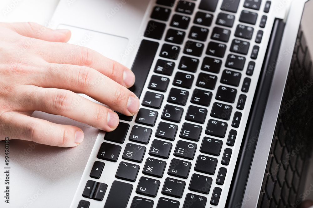 Close-up of typing male hands