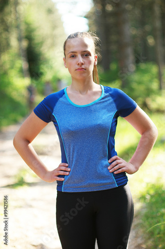 Young beautiful sporty girl in short green sports top training i © Myvisuals