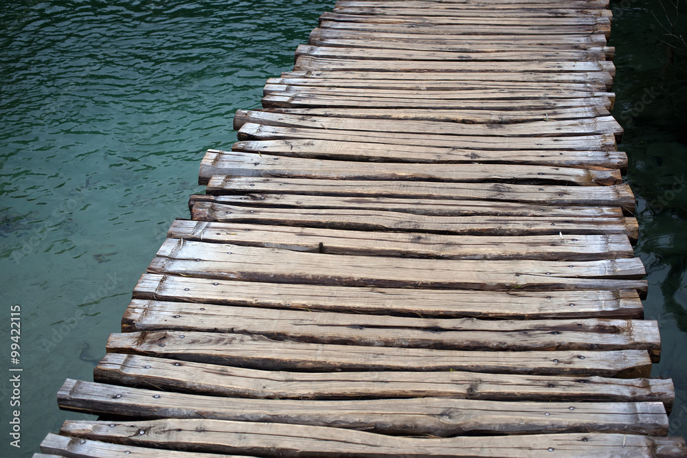 Fototapeta premium Timber walkway across lake