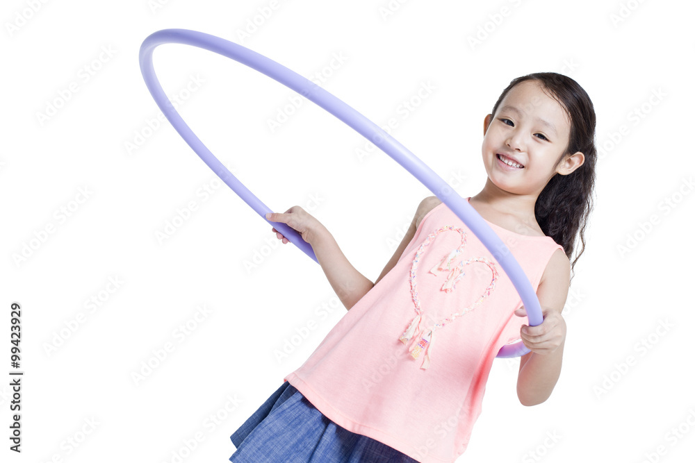 Happy girl spinning plastic hoop Happy girl spinning plastic hoop