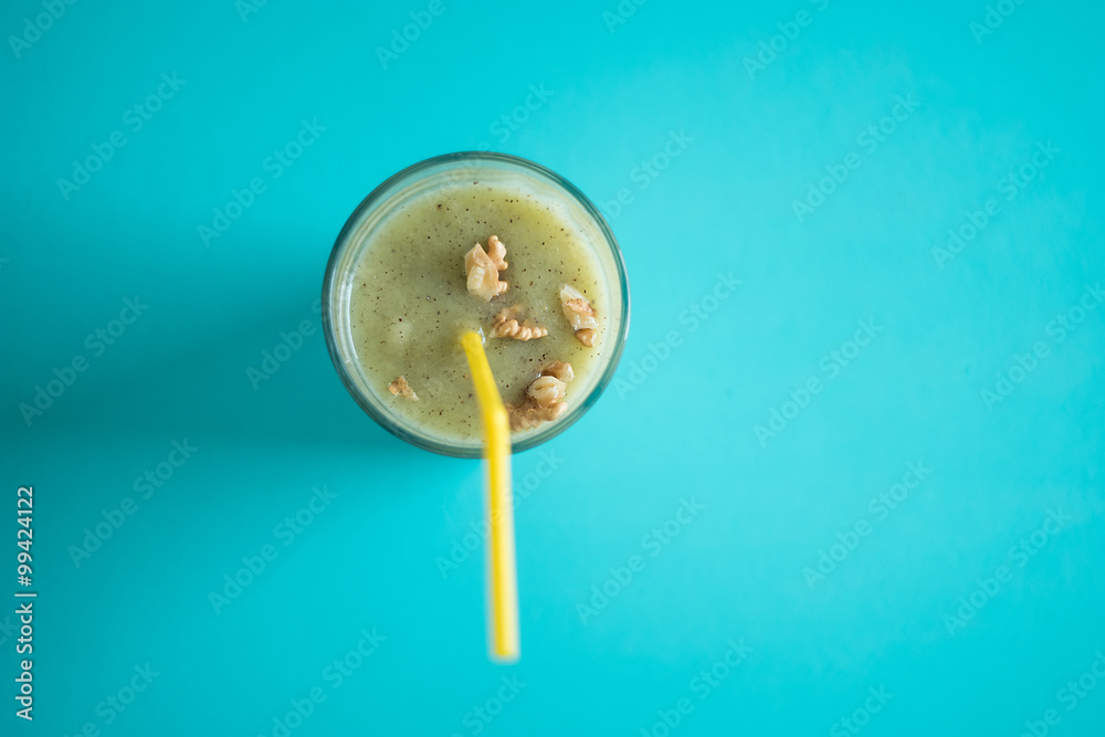 Chocolate banana smoothie in a glass with straws Chocolate banana smoothie in a glass with straws