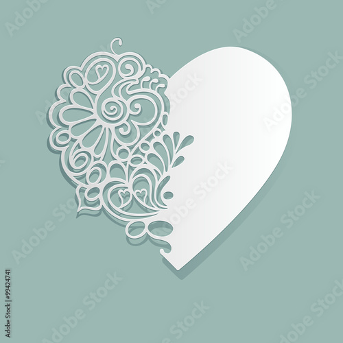 White heart. Heart made of paper. Cut lace pattern.