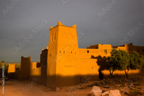 Old Maroko ksar in misty sunset photo