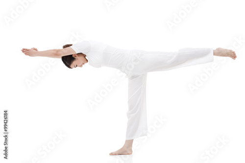 Young woman stretching and practicing yoga