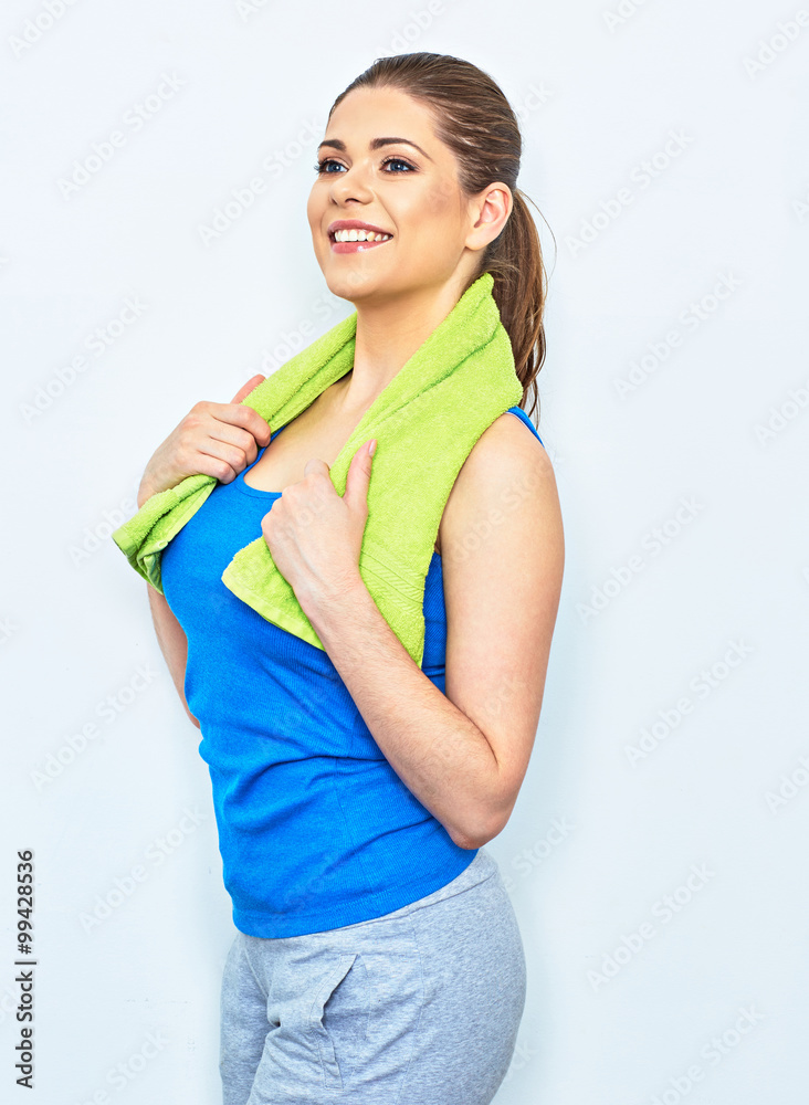 sport style portrait of young smiling woman with towel on shoul sport style portrait of young smiling woman with towel on shoul