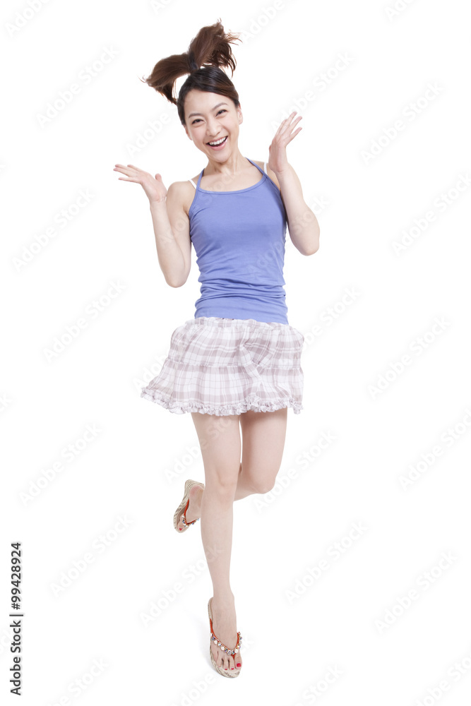 Excited young woman jumping Excited young woman jumping