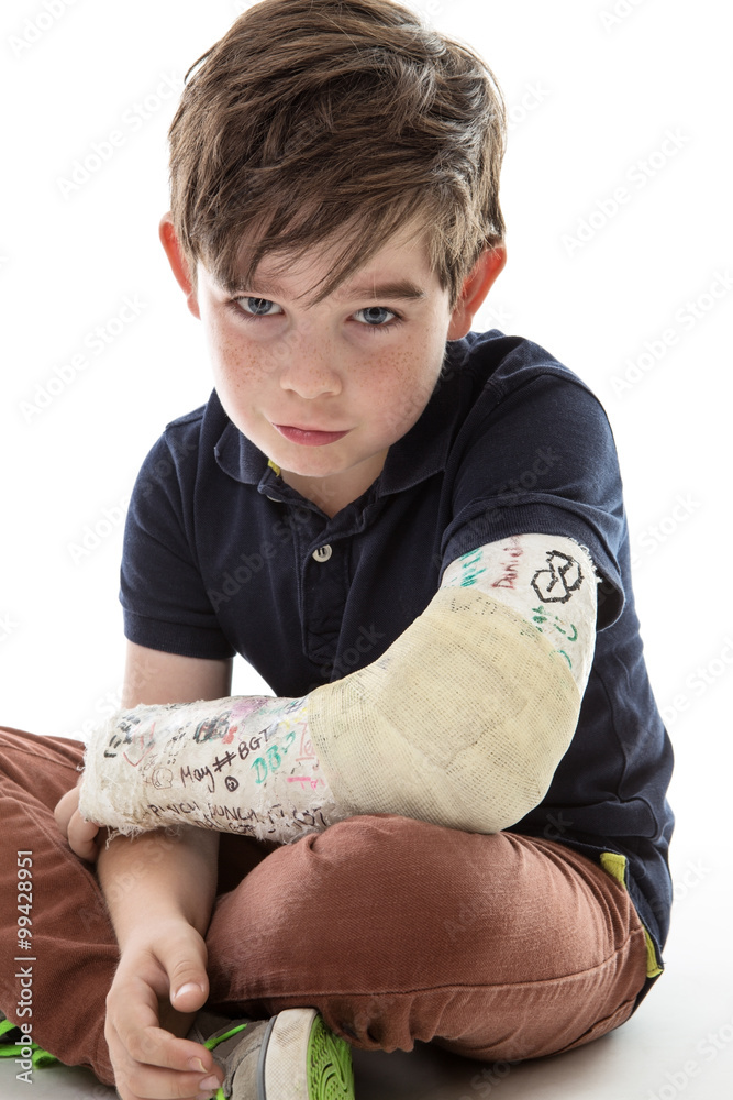 sad boy with broken arm