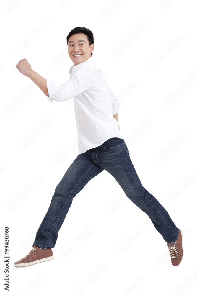 Young man jumping in mid air Young man jumping in mid air