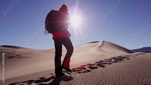 Traveller climber desert female sun adventure trek hiker