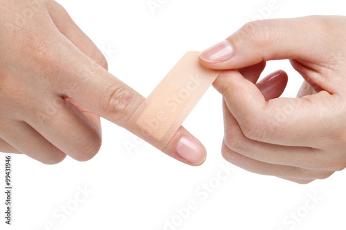 Woman Putting On A Bandage