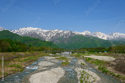 Fototapeta Naklejka Na Ścianę i Meble -  Shirouma mountains and Matsukawa river in Hakuba, Nagano, Japan