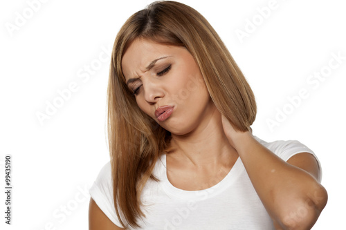 beautiful young woman has a pain in the neck