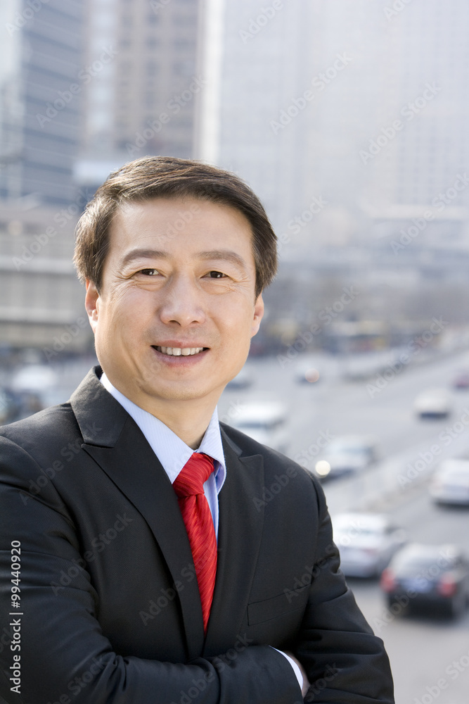 Businessman standing up over a road Businessman standing up over a road