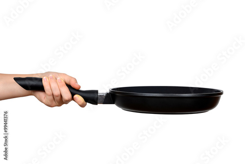 Woman's hand holding a frying pan isolated on white photo