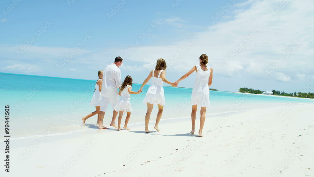leisure travel promotion beach ocean Caucasian happy family parents young girls leisure travel promotion beach ocean Caucasian happy family parents young girls