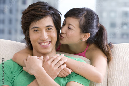 Asian couple holding each other