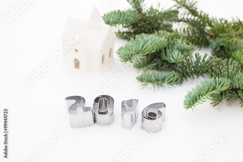 figures of new year and a fir-tree on snow