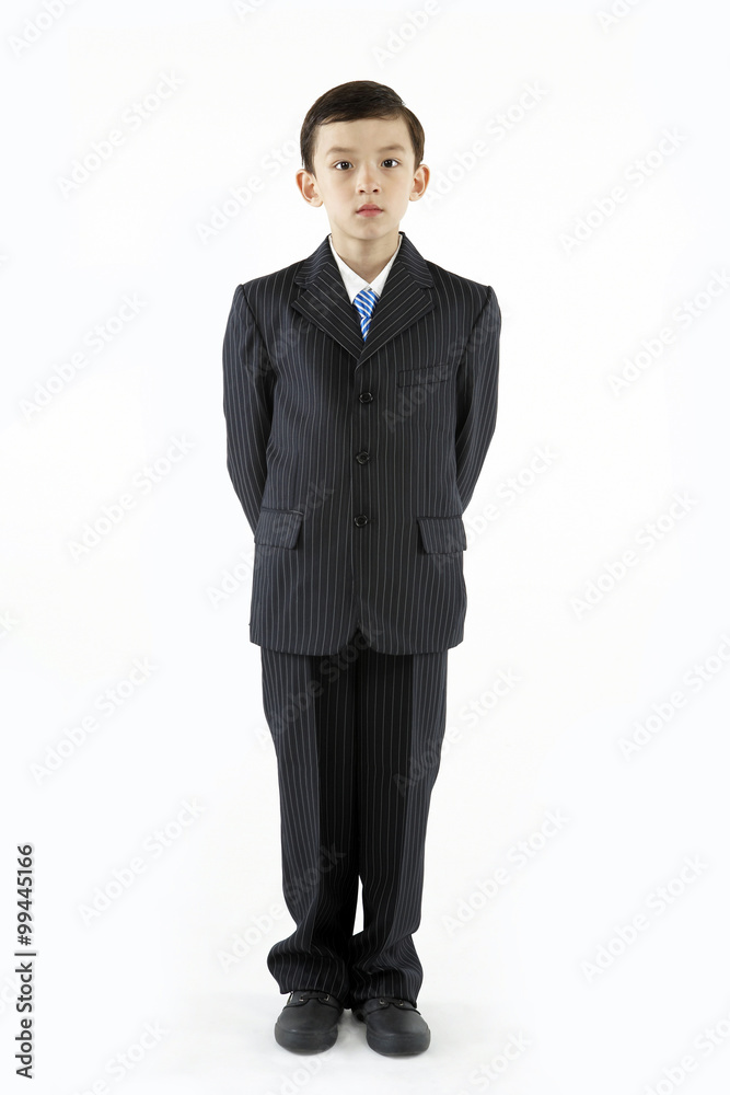 Portrait Of Boy Wearing A Suit Looking Serious Portrait Of Boy Wearing A Suit Looking Serious