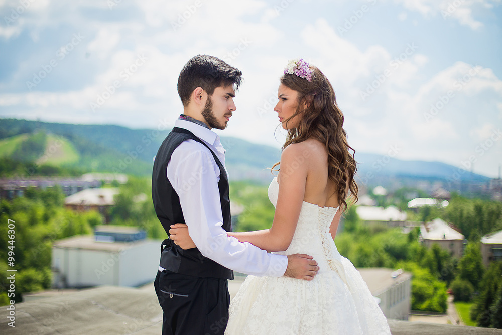 the groom with the bride on the rooftop the groom with the bride on the rooftop