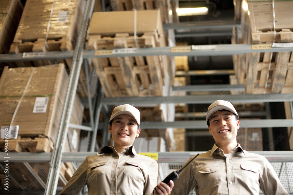 Male and female Chinese warehouse worker