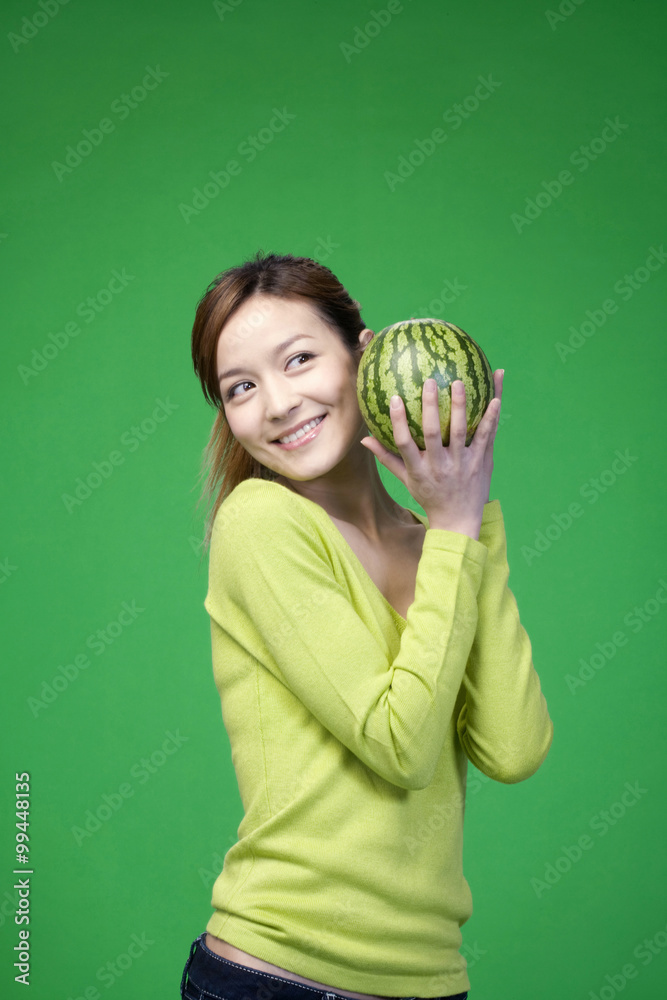 Woman in green with a melon Woman in green with a melon