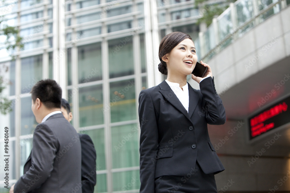 Happy business workers on the phone outside, Hong Kong Happy business workers on the phone outside, Hong Kong
