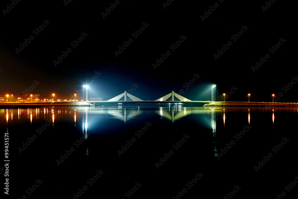 Fototapeta premium HDR of Sheikh Isa Bin Salman causeway Bridge and reflection on water