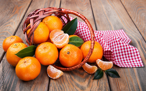 Juicy orange tangerines photo