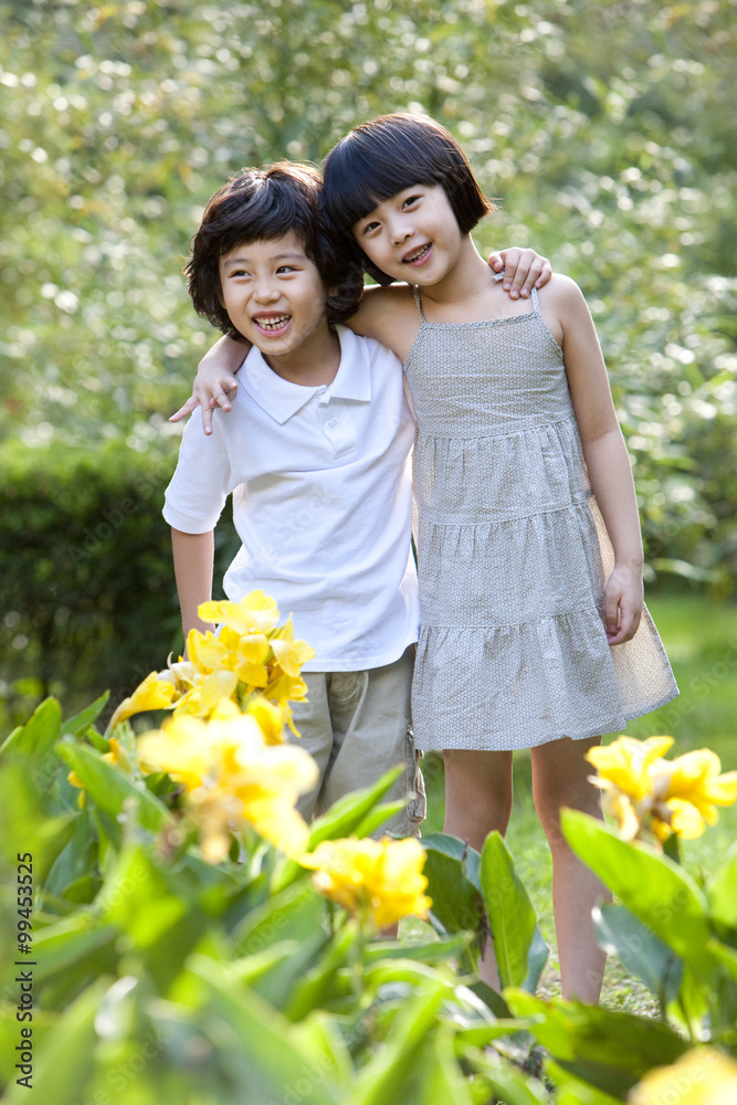 Cute children having fun in garden Cute children having fun in garden