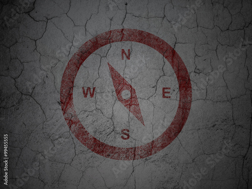 Travel concept: Compass on grunge wall background