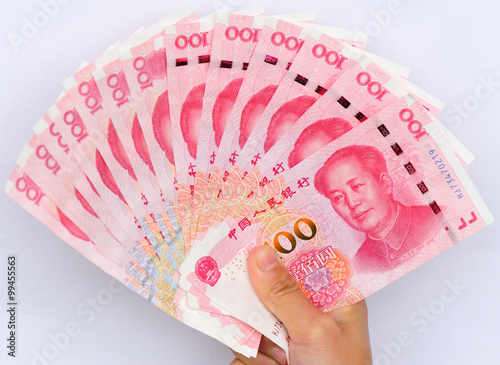 Hand with chinese yuan money photo