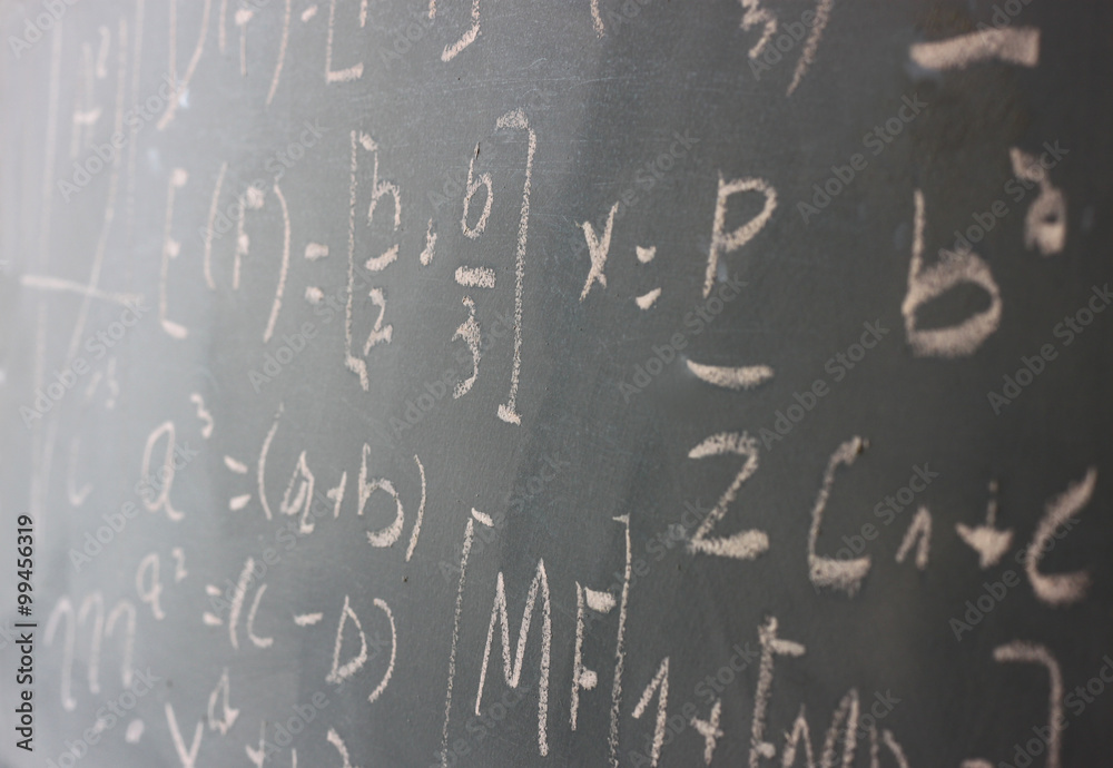 side view of math formulas and calculation written over chalkboard. selective focus.
side view of math formulas and calculation written over chalkboard. selective focus.