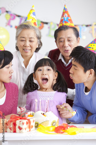 Young Chinese girl's birthday with family