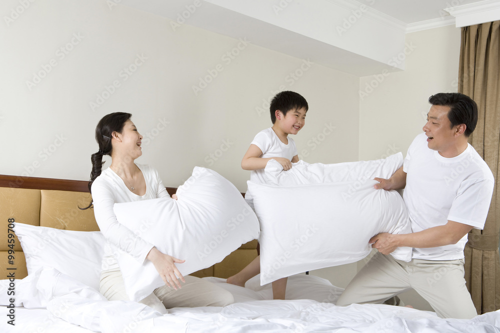 Family having pillow fight