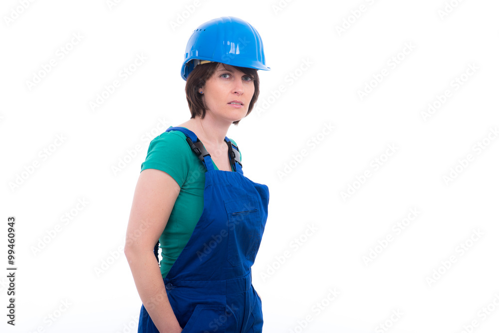 Junge Frau mit Latzhose und Bau-Helm Junge Frau mit Latzhose und Bau-Helm