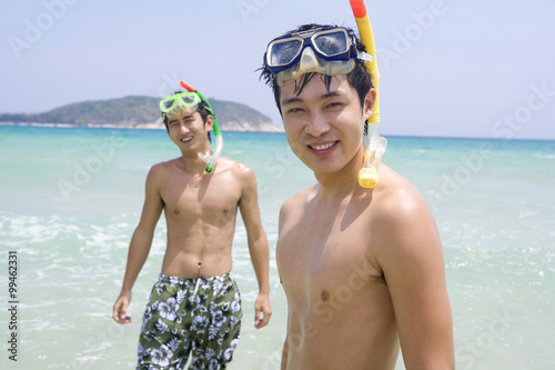 Young men wearing snorkel gear