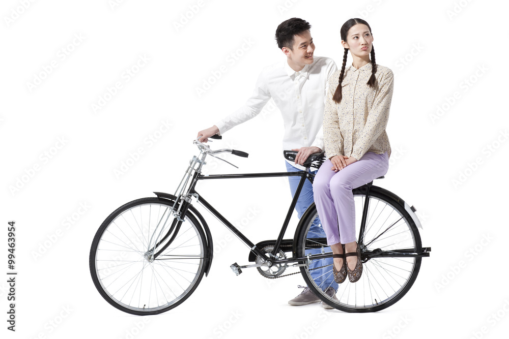 Retro couple with an old-fashioned bicycle Retro couple with an old-fashioned bicycle