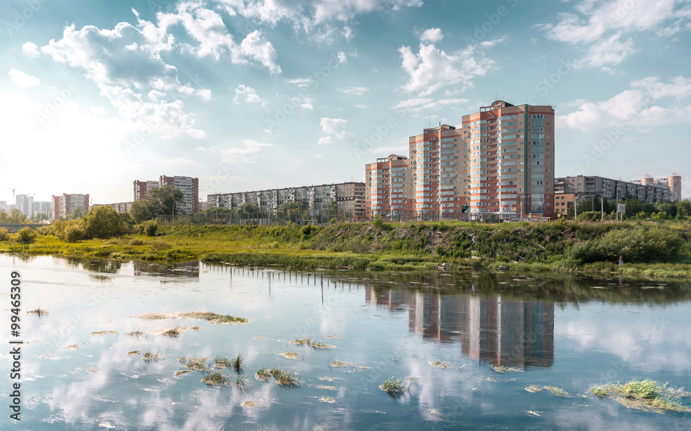 Chelyabinsk city landscape with a blue sky and Miass river.