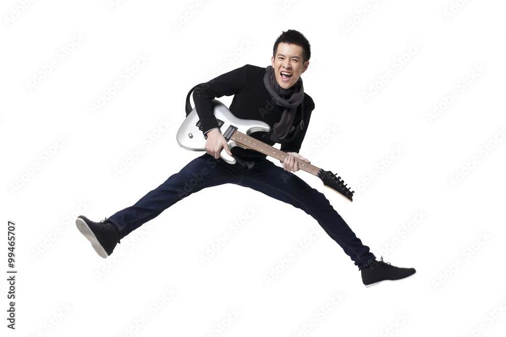 Stylish young man playing guitar Stylish young man playing guitar