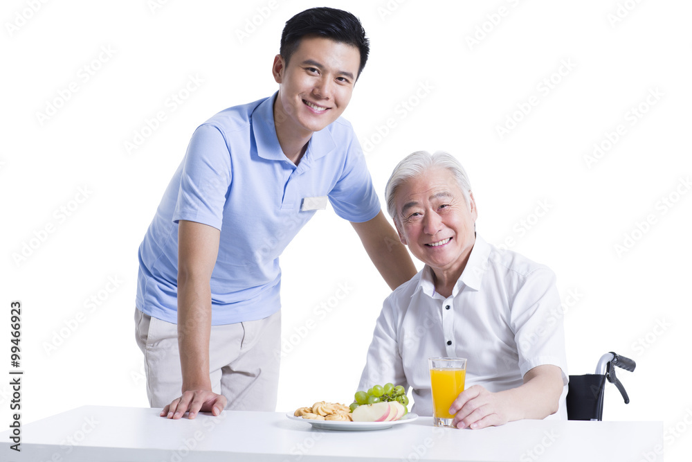 Disabled senior man having breakfast in nursing home Disabled senior man having breakfast in nursing home
