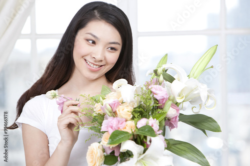 Young woman arranging flowers