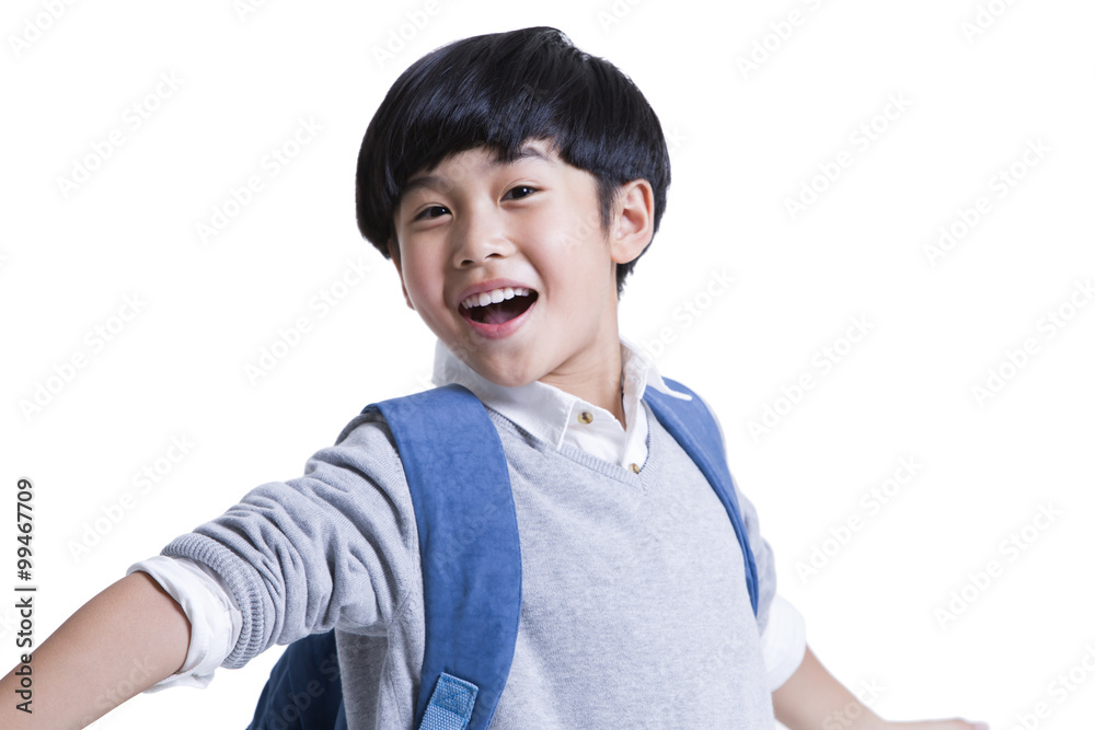 Cheerful boy with schoolbag on back Cheerful boy with schoolbag on back