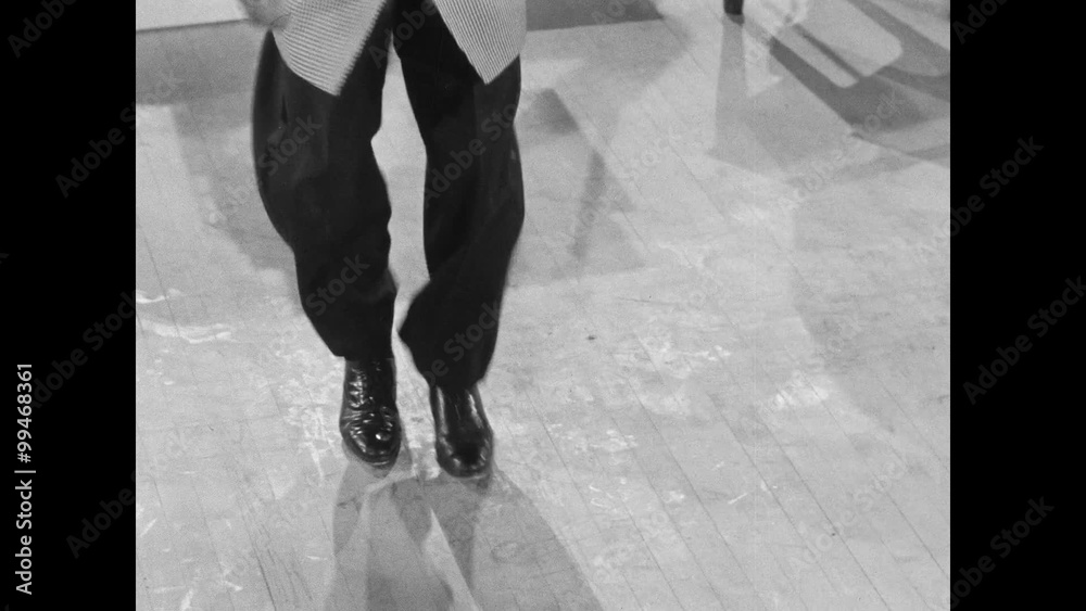 Low angle view of tap dancer with slick moves, 1950s