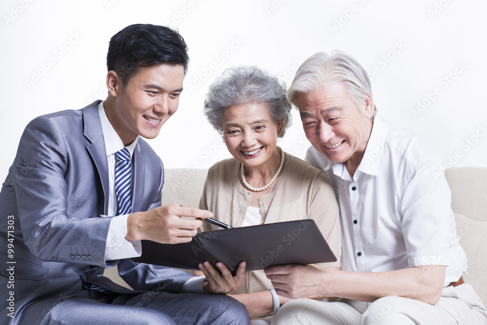 Senior couple with financial advisor Senior couple with financial advisor