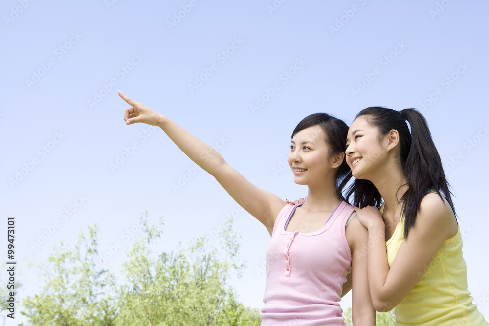 Portrait of two girlfriends at the park Portrait of two girlfriends at the park