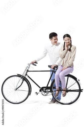 Sweet retro couple with an old-fashioned bicycle