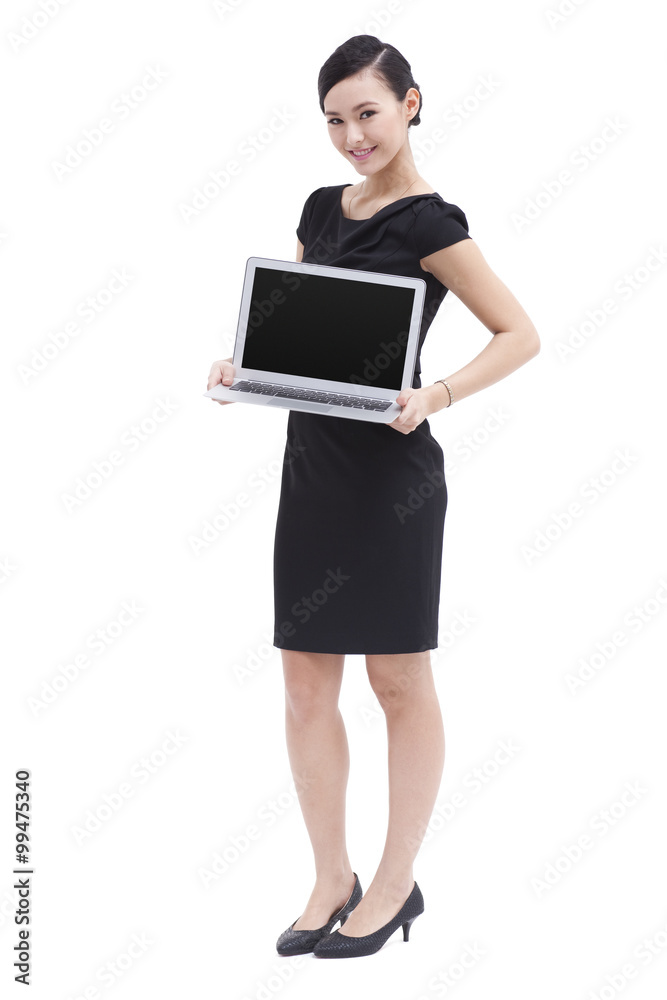 Fashionable businesswoman showing laptop Fashionable businesswoman showing laptop