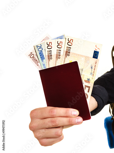 Human tourist holding money and passport.