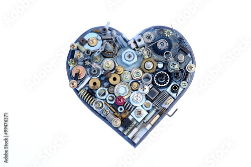 Fototapeta Naklejka Na Ścianę i Meble -  Heart shaped object made of various metal screws isolated on white background