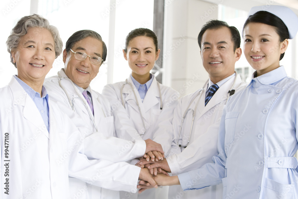Doctors and Nurse Hands in a Huddle